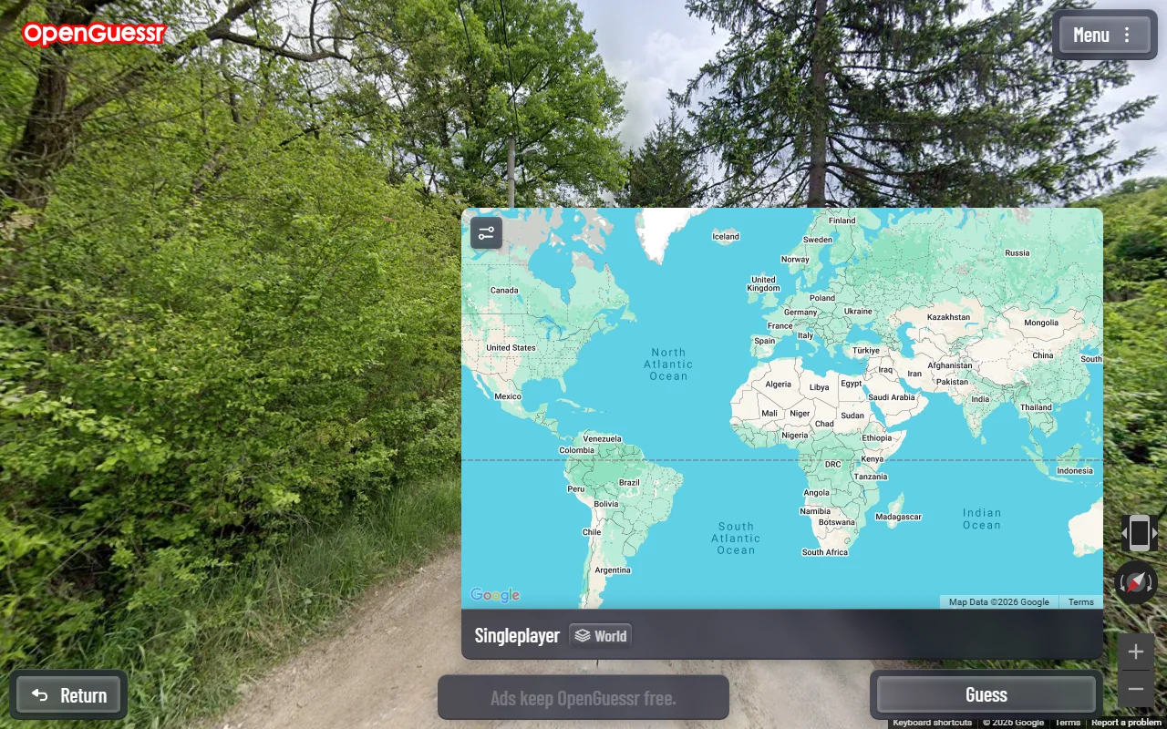An OpenGuessr round in progress with the guessing map expanded over the right half of the screen