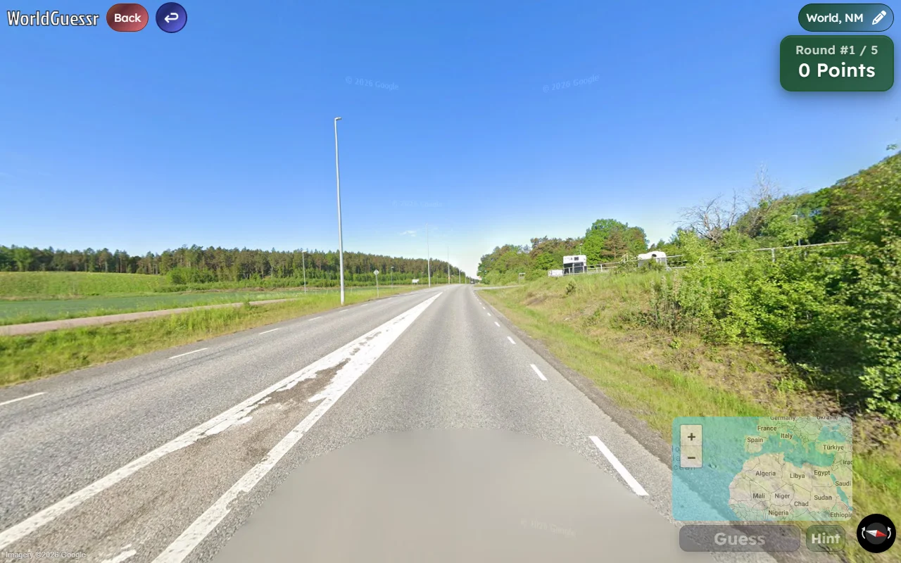 A WorldGuessr No Move round: a highway with no road name labels and no Google controls on the panorama